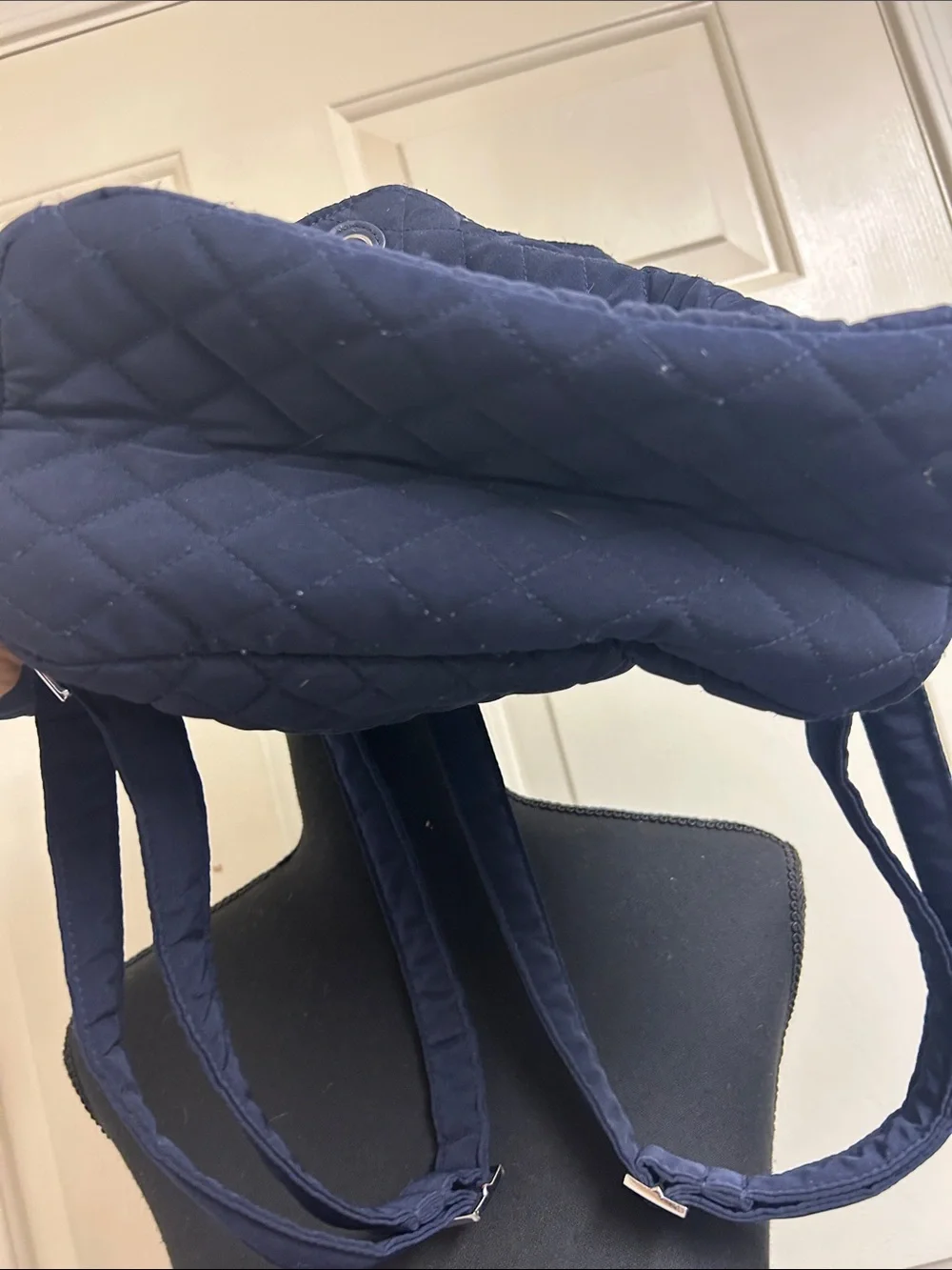 Vera Bradley quilted backpack in navy blue, diamond pattern a front flap closure
